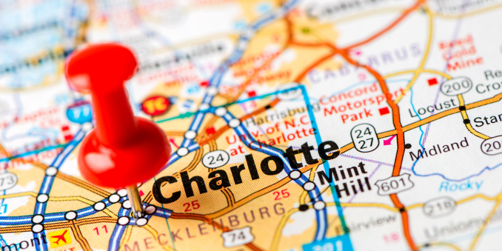 Red pushpin marking the city of Charlotte on a detailed map, highlighting the location relevant to Premier Marketing's services in Charlotte, NC.